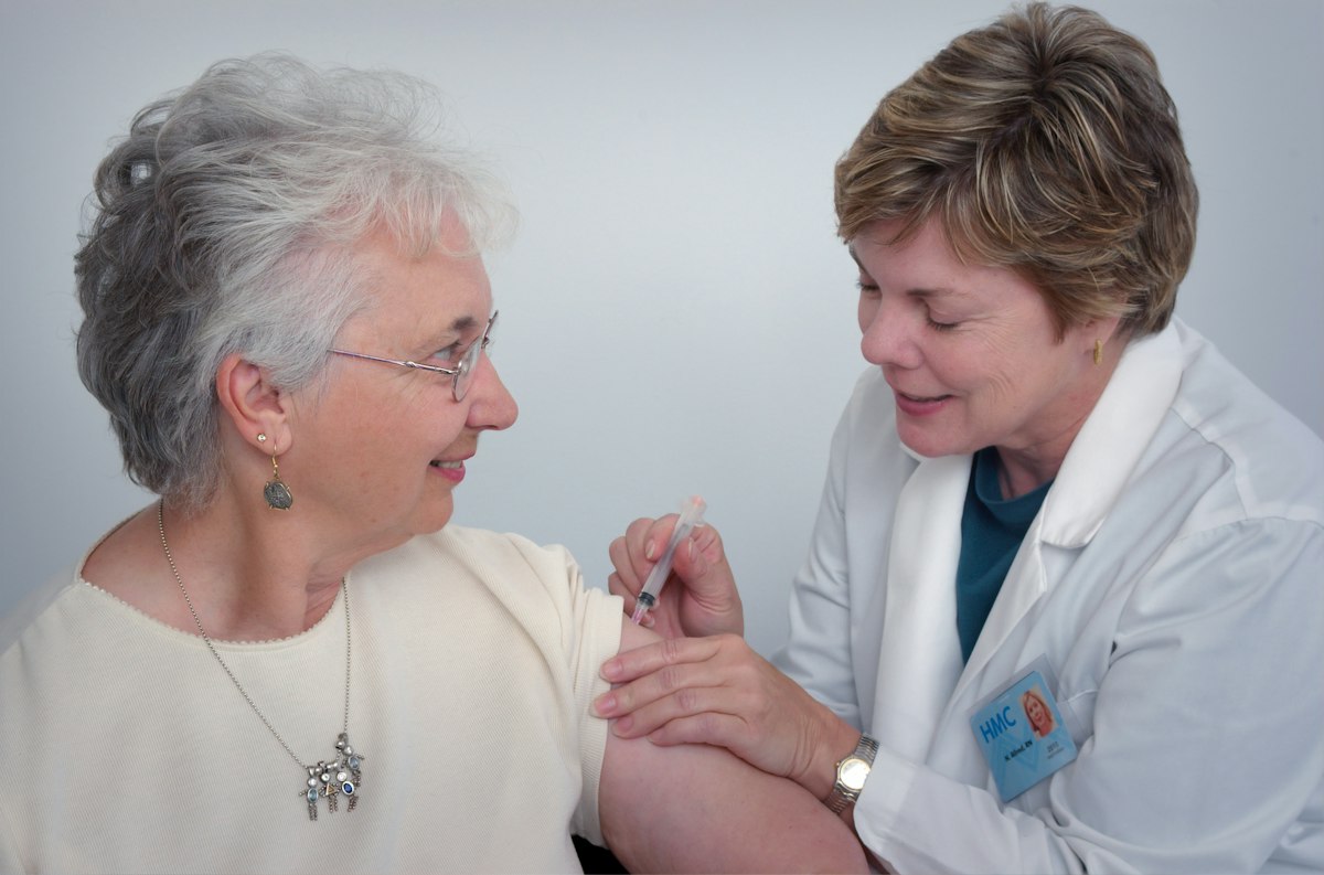 Nurse caring for a senior patient